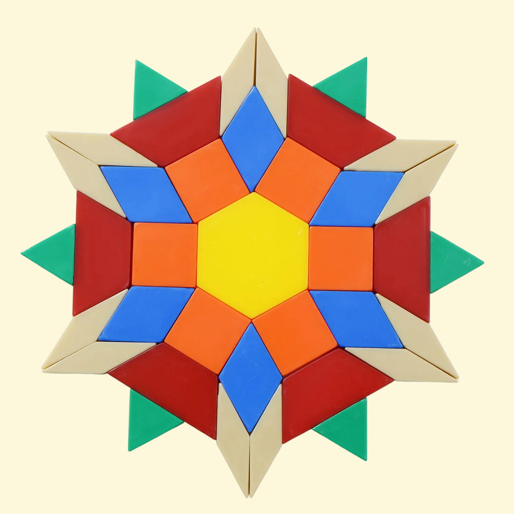 A colorful geometric star-shaped pattern made of plastic geometric pieces on a butter background.