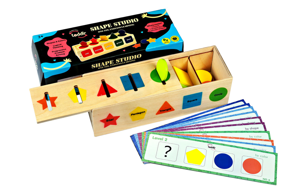 Wooden shape sorting toy with cards on a white background