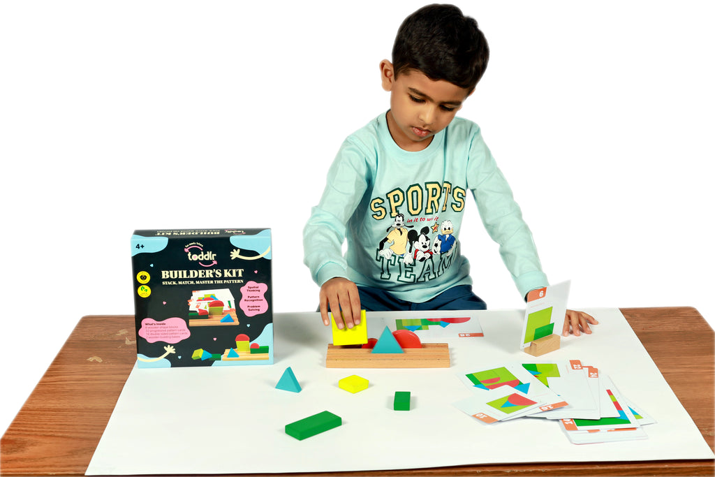 Child playing with a wooden building block set on a table
